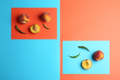 Photo of Flat lay composition with fresh peaches on color background. Space for text