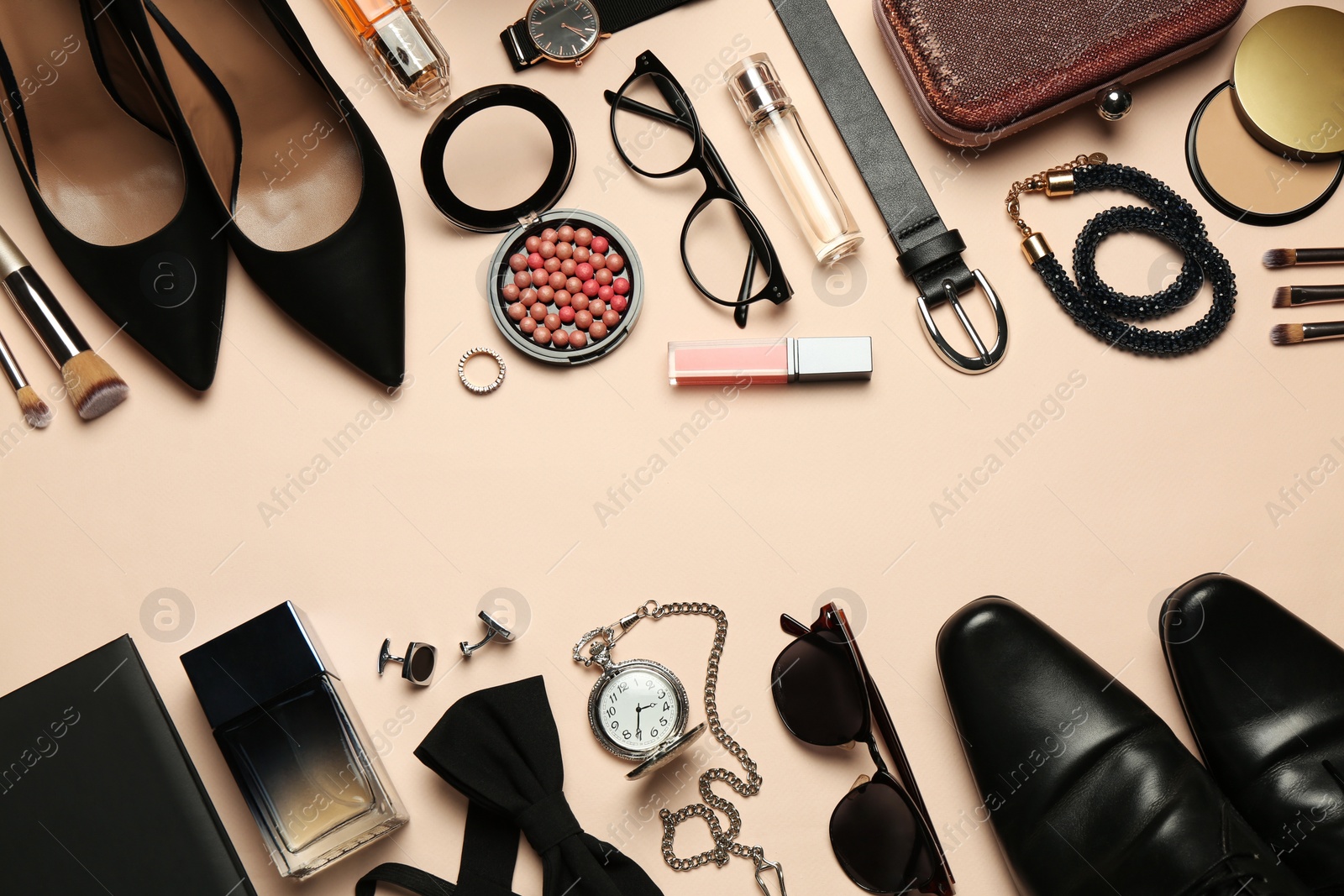 Photo of Fashionable male and female accessories on beige background, flat lay. Space for text