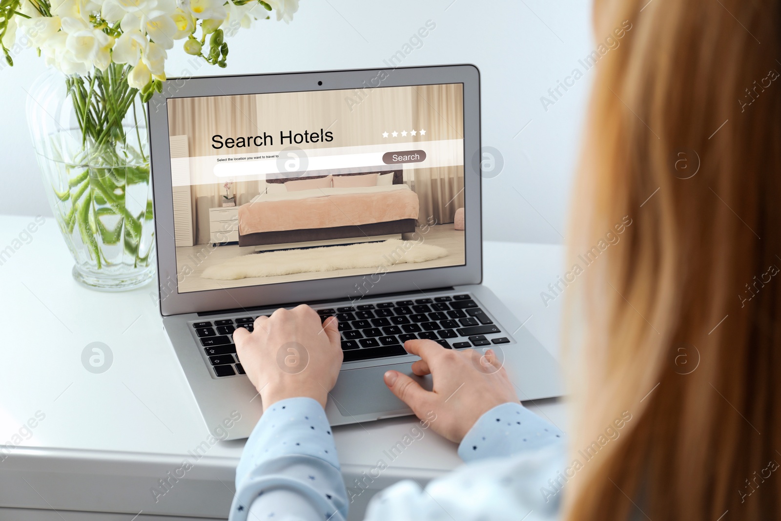 Image of Woman searching hotel using laptop at table, closeup. Booking online service