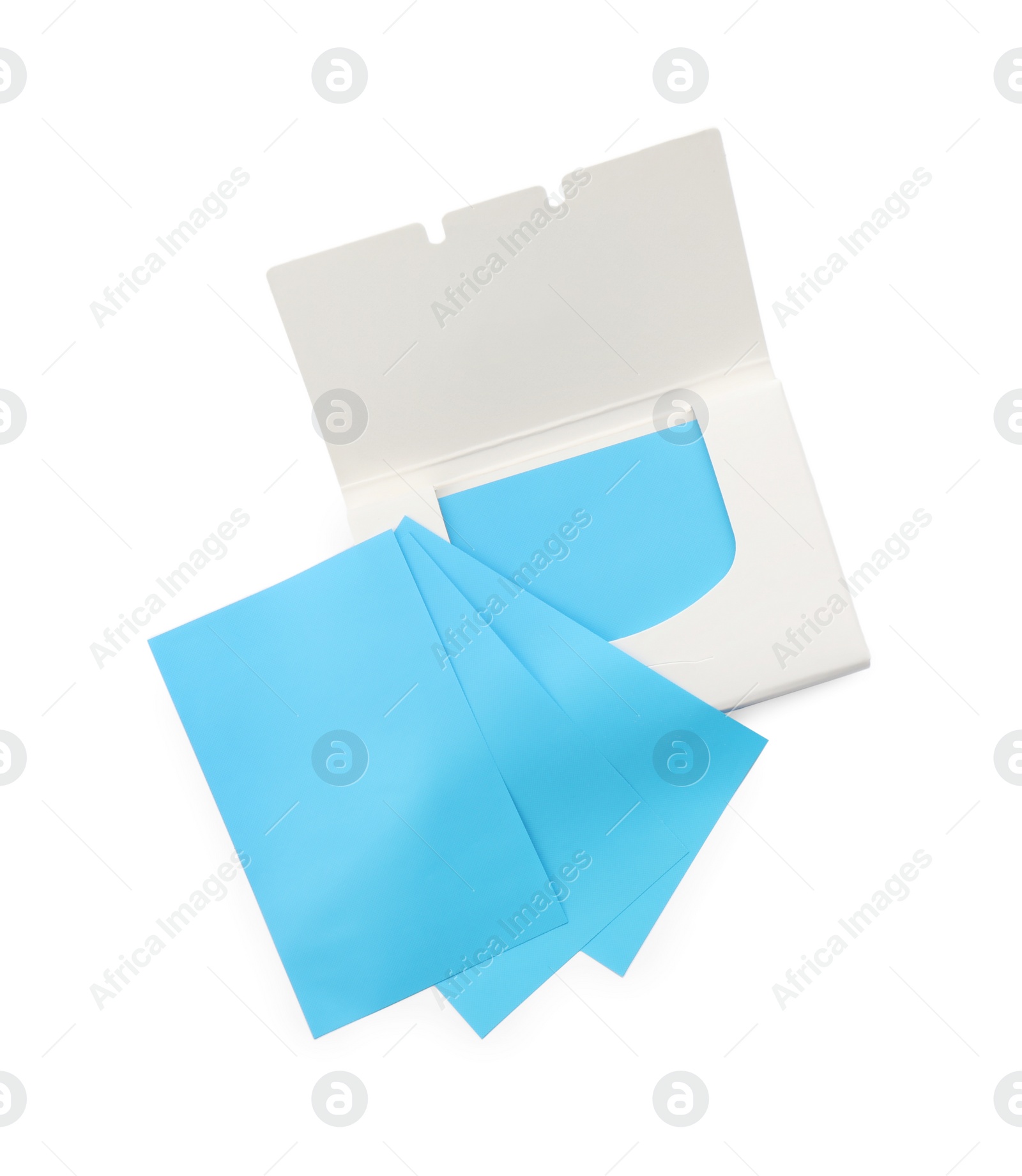 Photo of Open package of facial oil blotting tissues on white background, top view