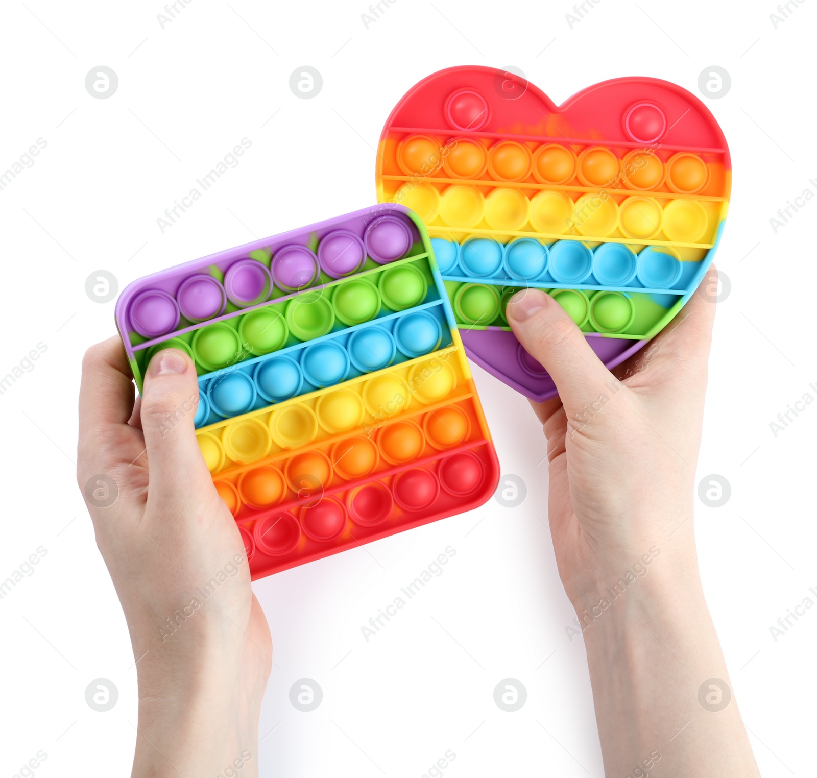 Photo of Woman holding pop it fidget toys on white background, closeup