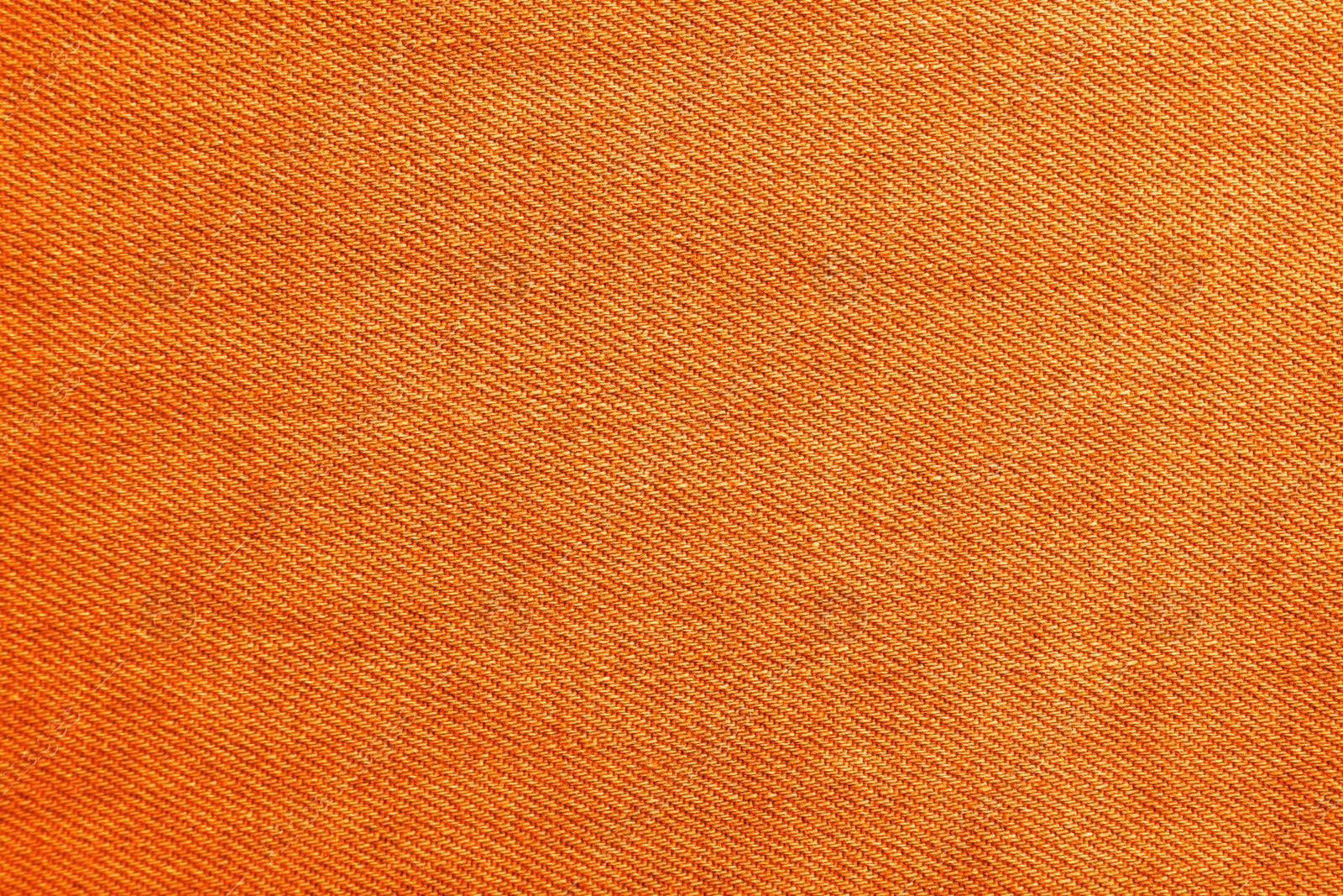 Image of Texture of orange jeans as background, closeup