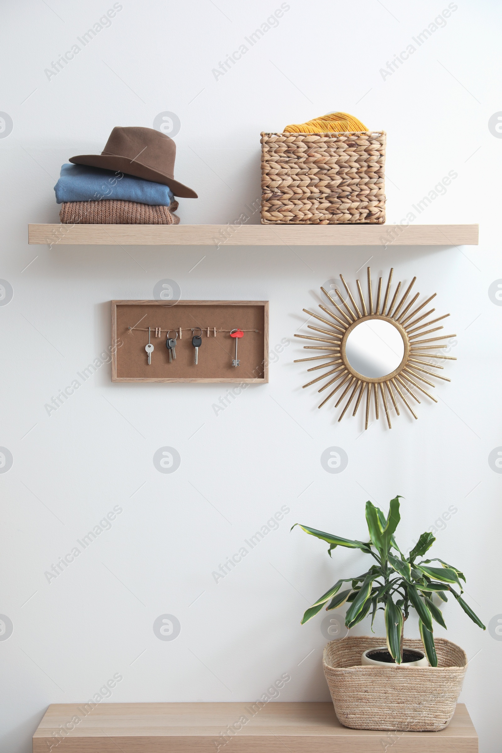 Photo of Hallway interior with stylish furniture, clothes and accessories
