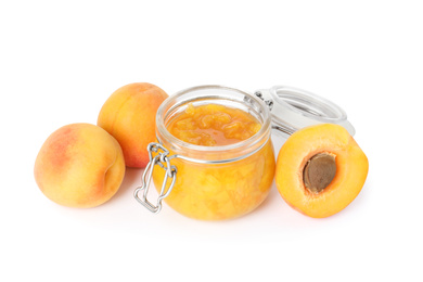 Photo of Jar of apricot jam and fresh fruits on white background