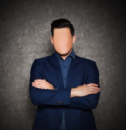Anonymous. Faceless man in suit near grey wall