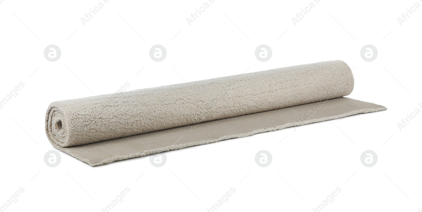 Photo of Rolled soft carpet on white background. Interior element