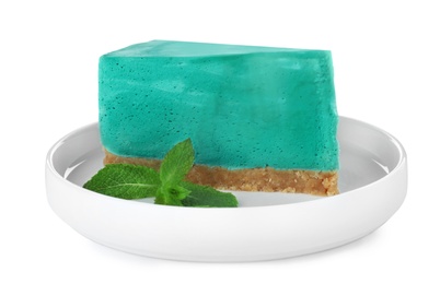 Photo of Piece of delicious spirulina cheesecake isolated on white