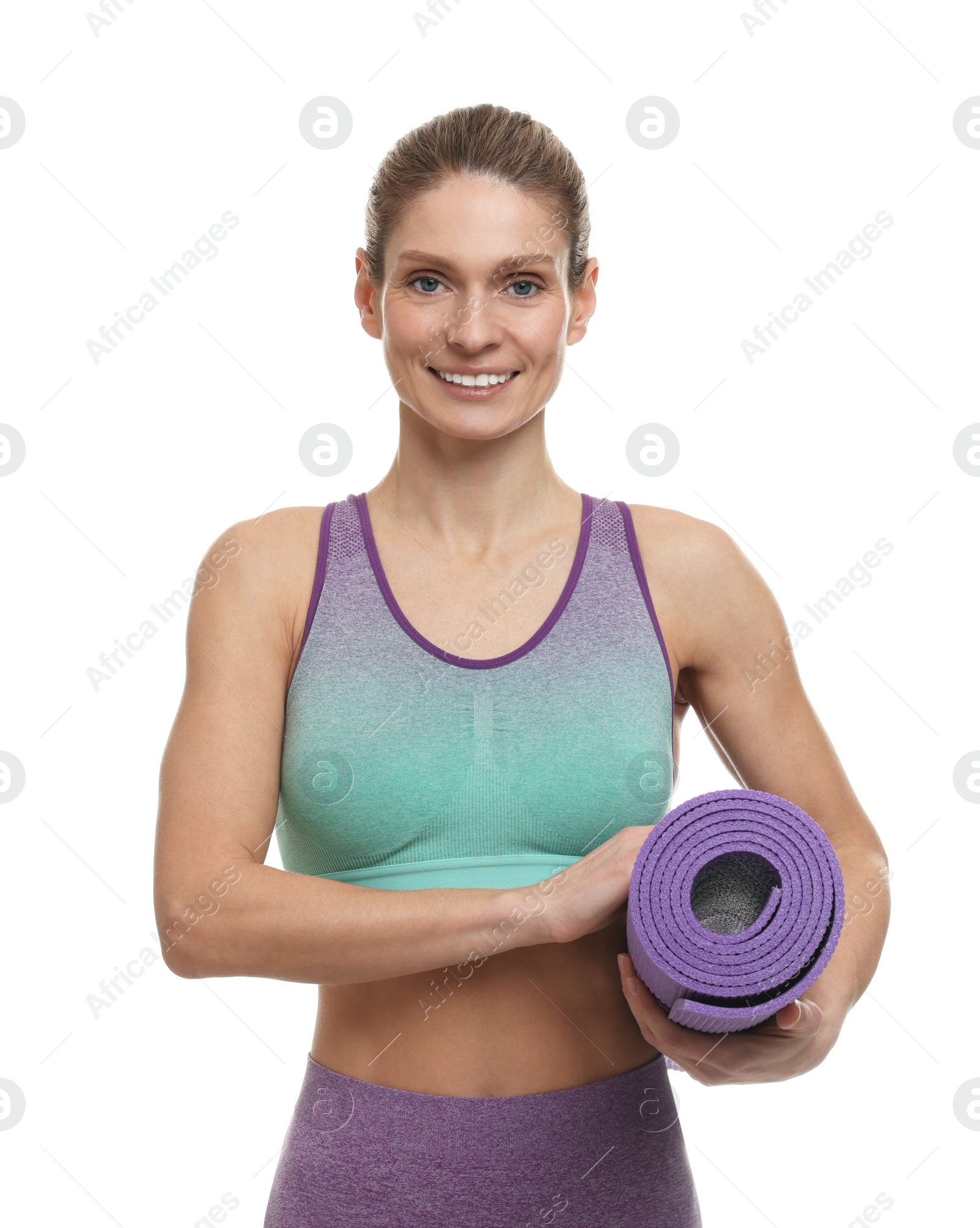 Photo of Portrait of sportswoman with fitness mat on white background