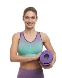Photo of Portrait of sportswoman with fitness mat on white background