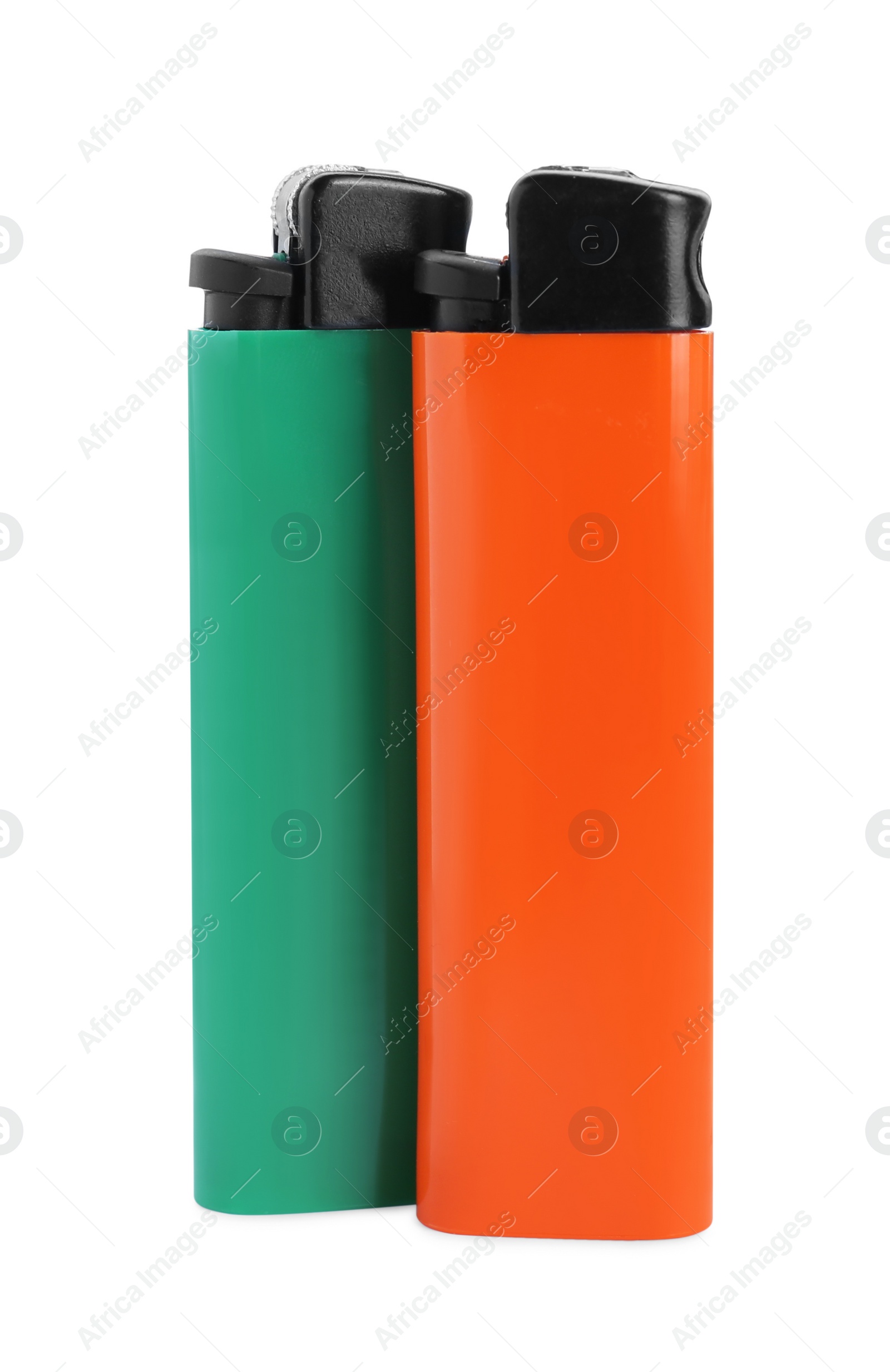 Photo of Stylish small pocket lighters on white background