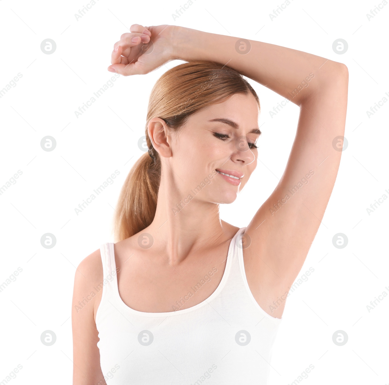 Photo of Young woman showing armpit on white background. Using deodorant