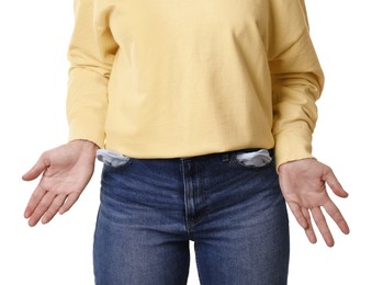 Photo of Poor woman showing empty pockets on white background, closeup