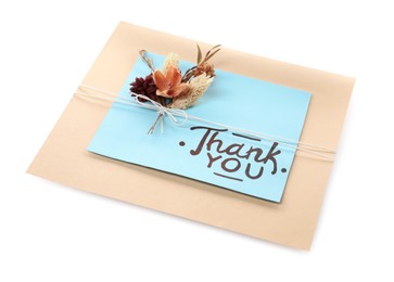 Photo of Card with phrase Thank You and dried flowers isolated on white