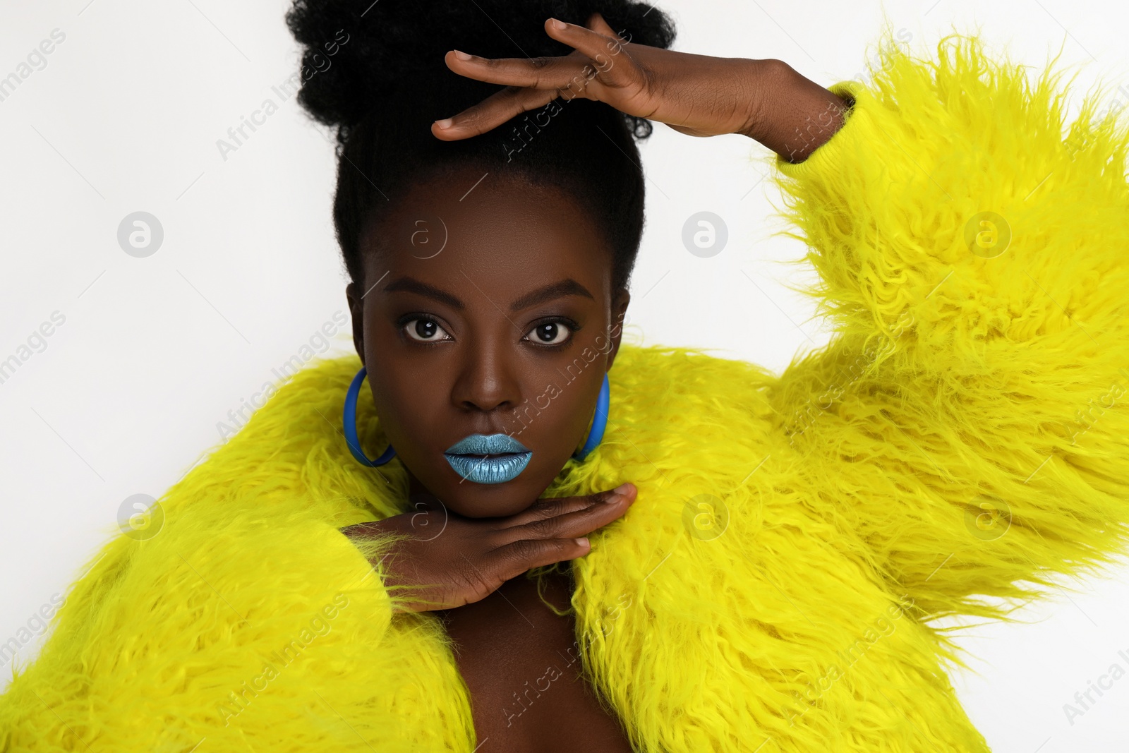 Photo of Fashionable portrait of beautiful woman with bright makeup on white background