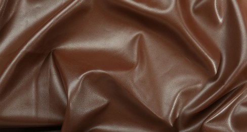 Brown natural leather as background, top view