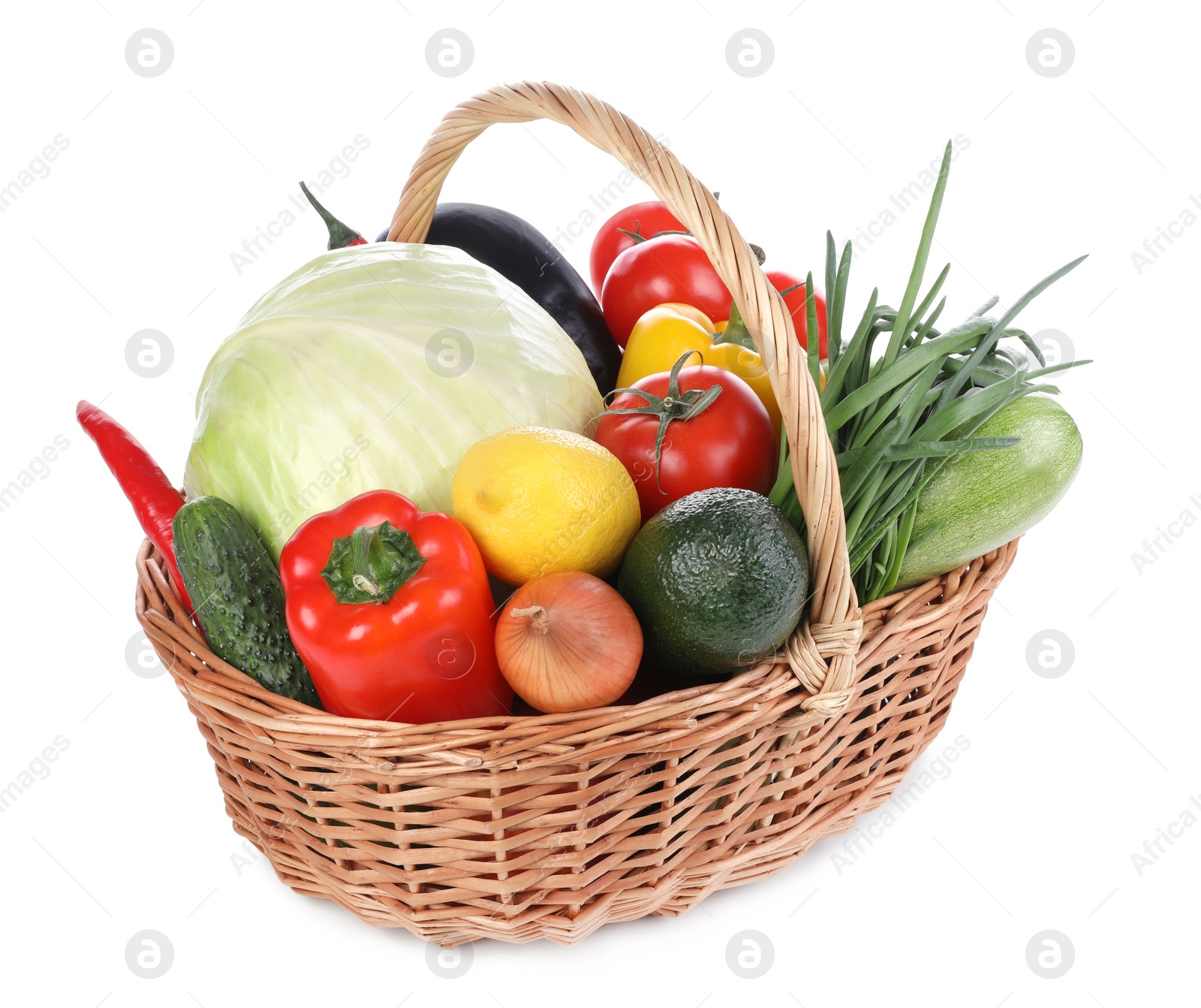 Photo of Fresh ripe vegetables and fruit in wicker basket on white background