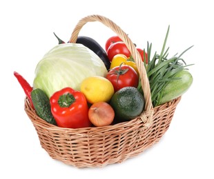 Fresh ripe vegetables and fruit in wicker basket on white background