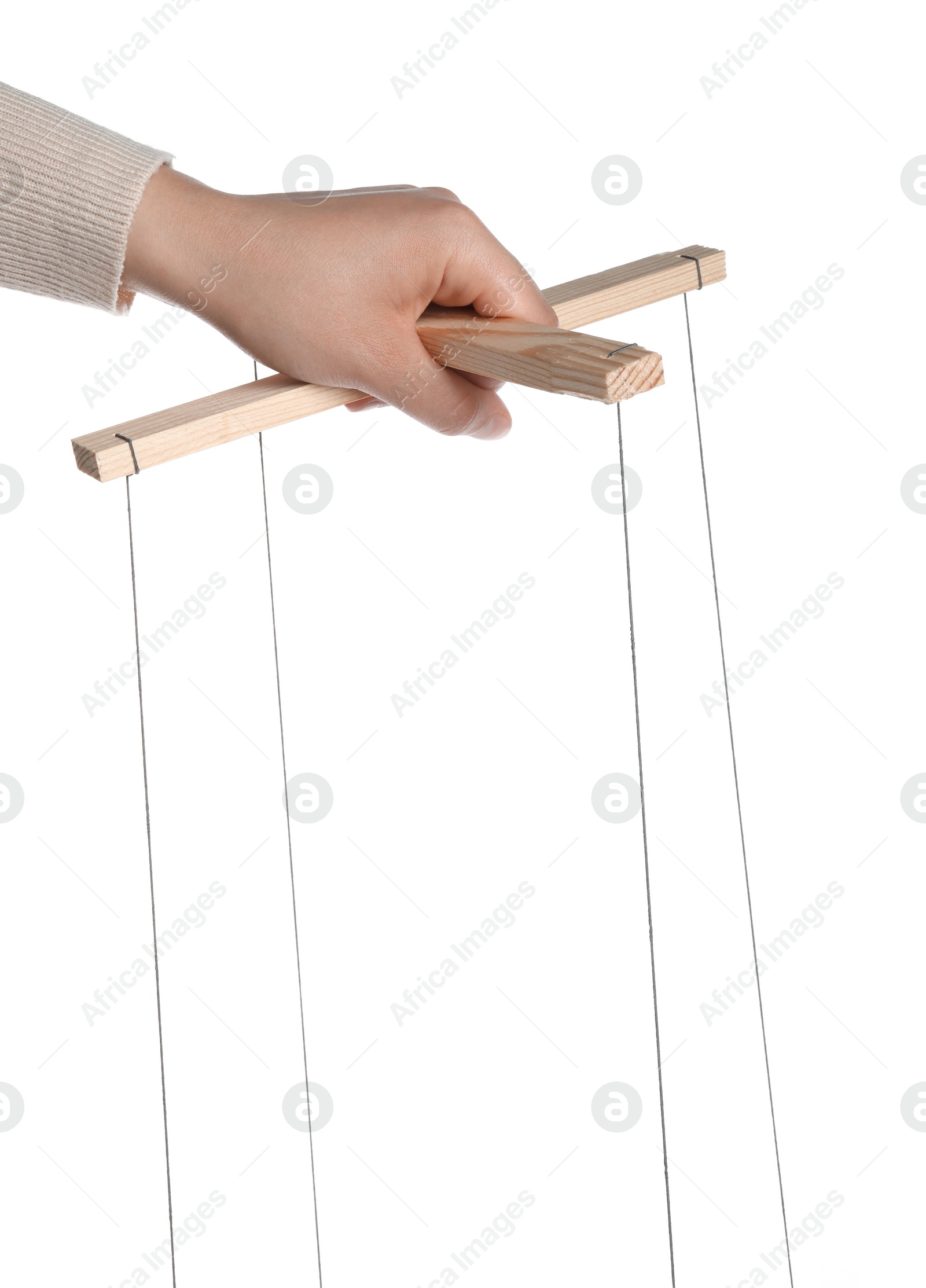 Photo of Woman pulling strings of puppet on white background, closeup