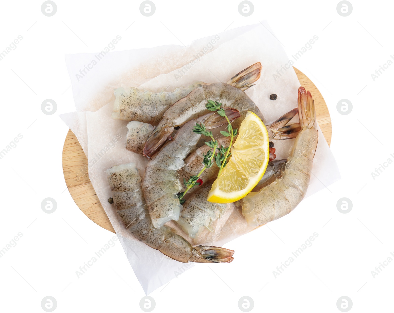 Photo of Wooden board with raw shrimps, lemon and thyme isolated on white, top view