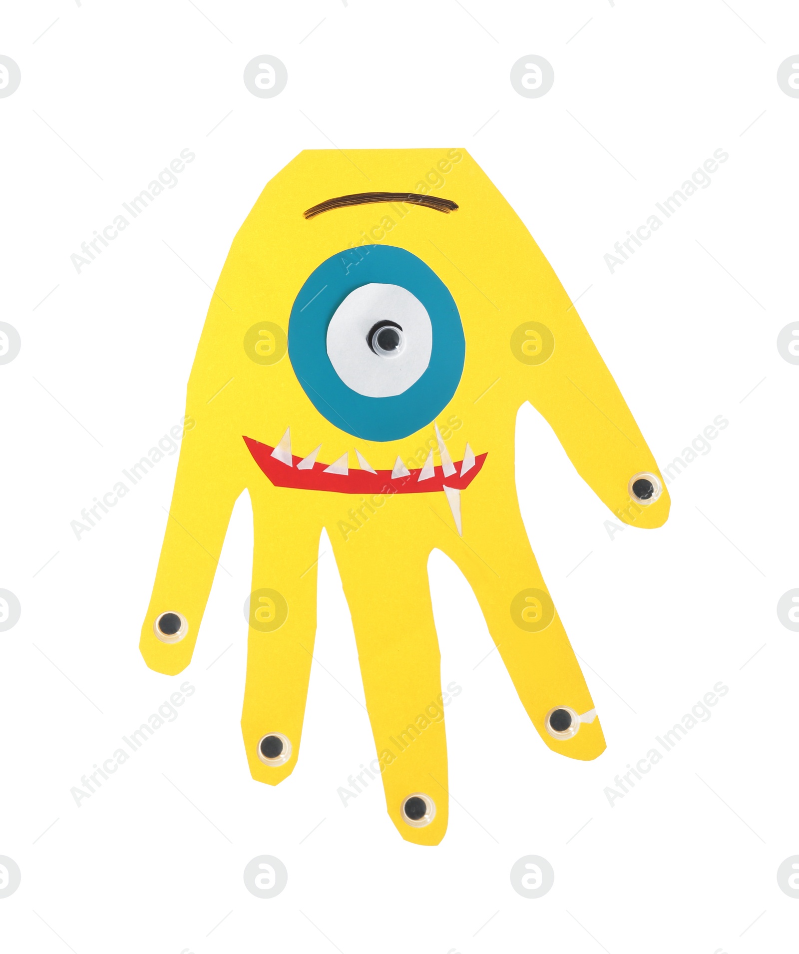 Photo of Funny yellow hand shaped monster isolated on white, top view. Halloween decoration