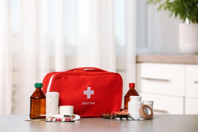 First aid kit on light grey table indoors