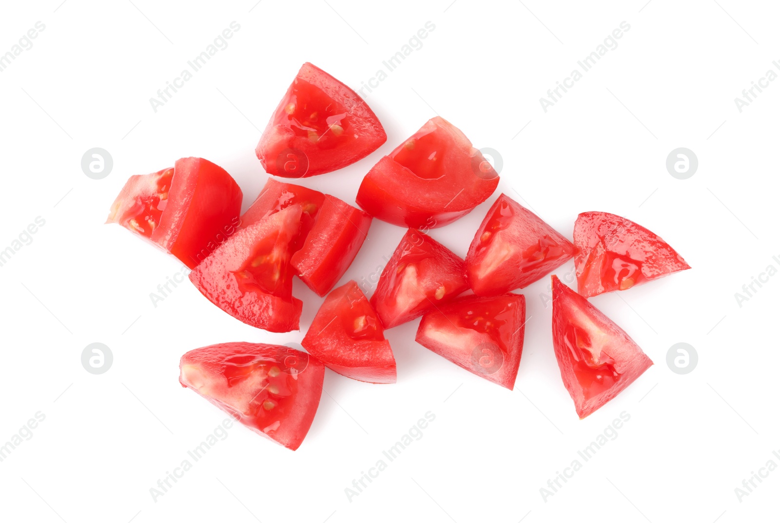 Photo of Pieces of red ripe tomato isolated on white, top view