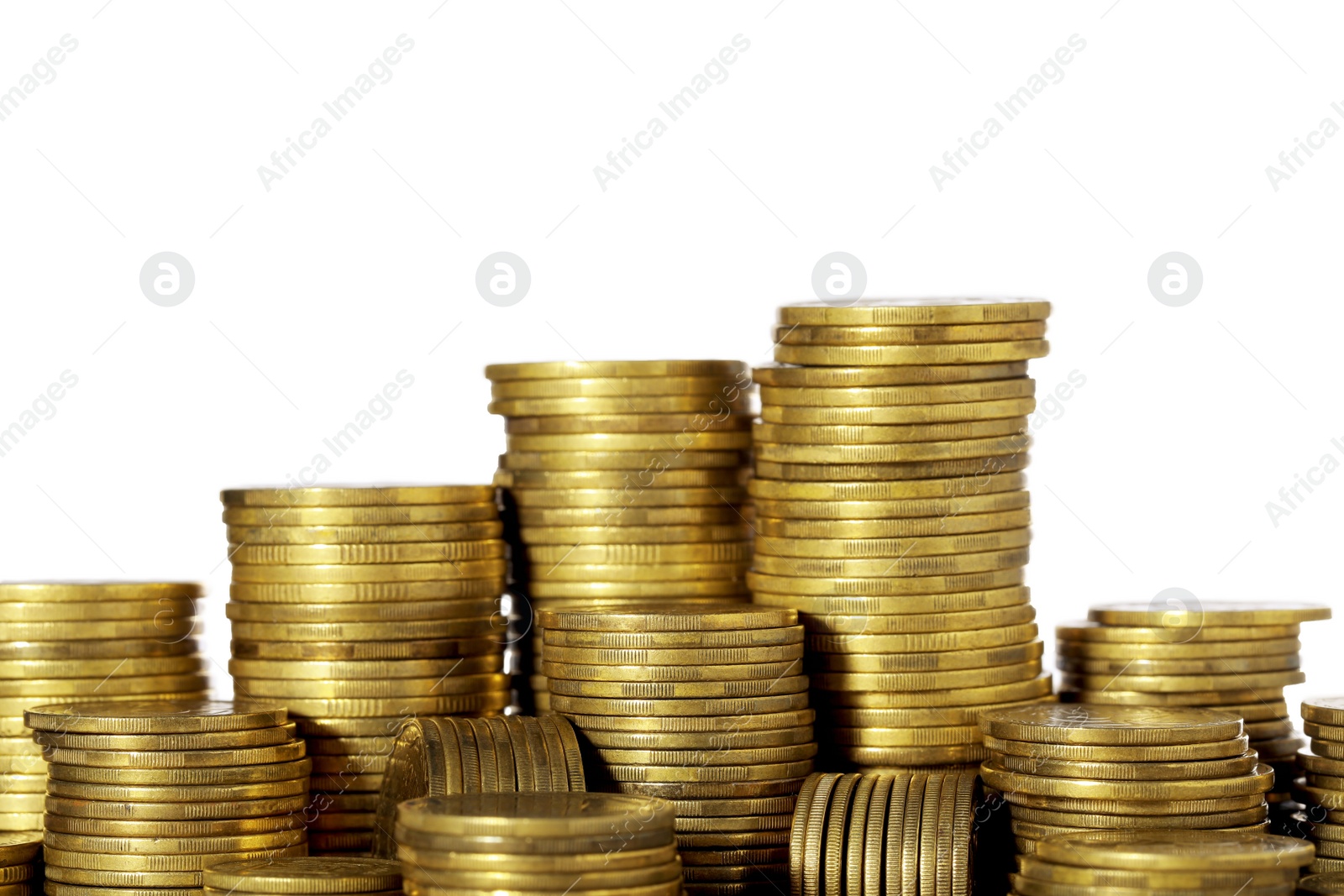 Photo of Many golden coins stacked on white background