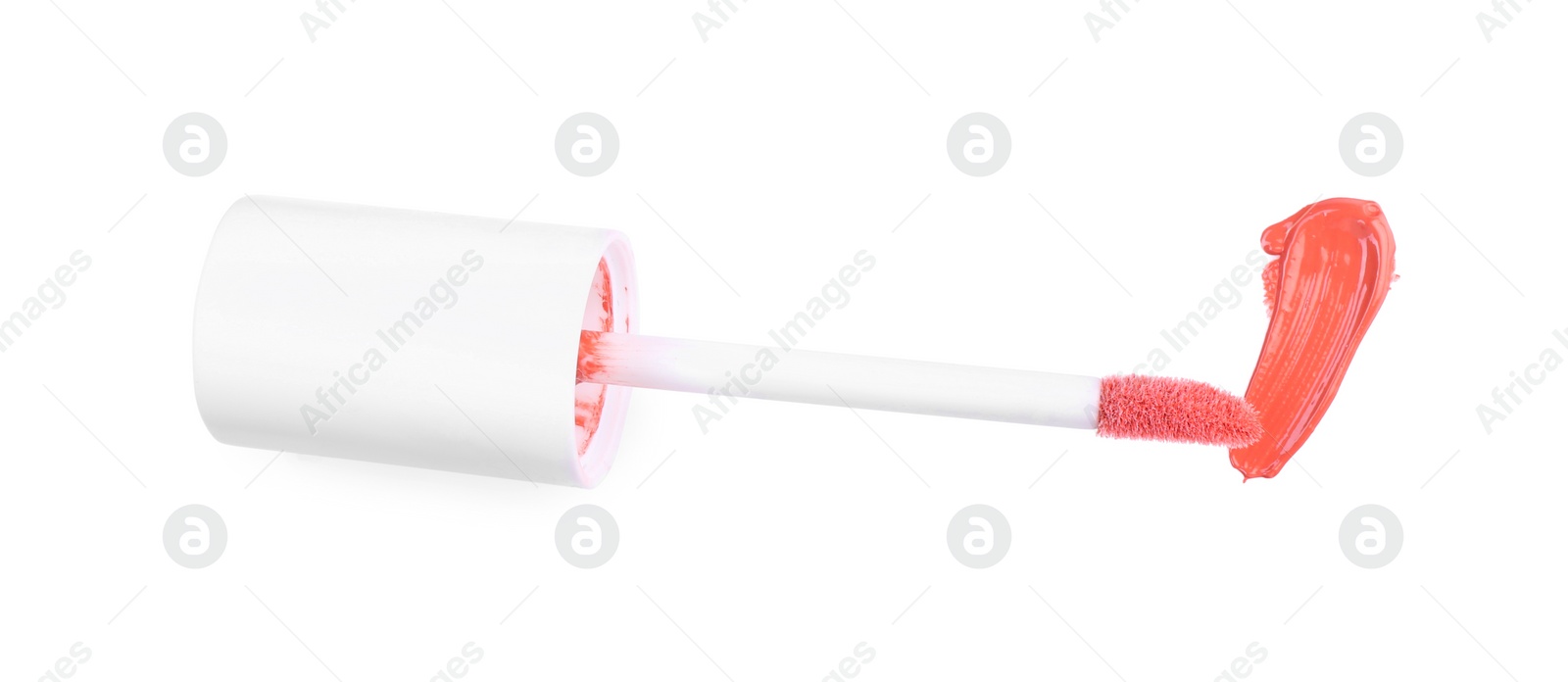 Photo of Stroke of color lip gloss and applicator isolated on white, top view
