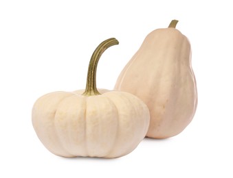 Two ripe beige pumpkins isolated on white