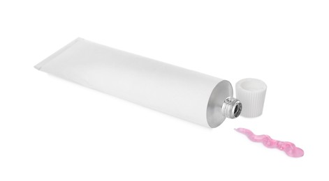 Open tube with ointment on white background