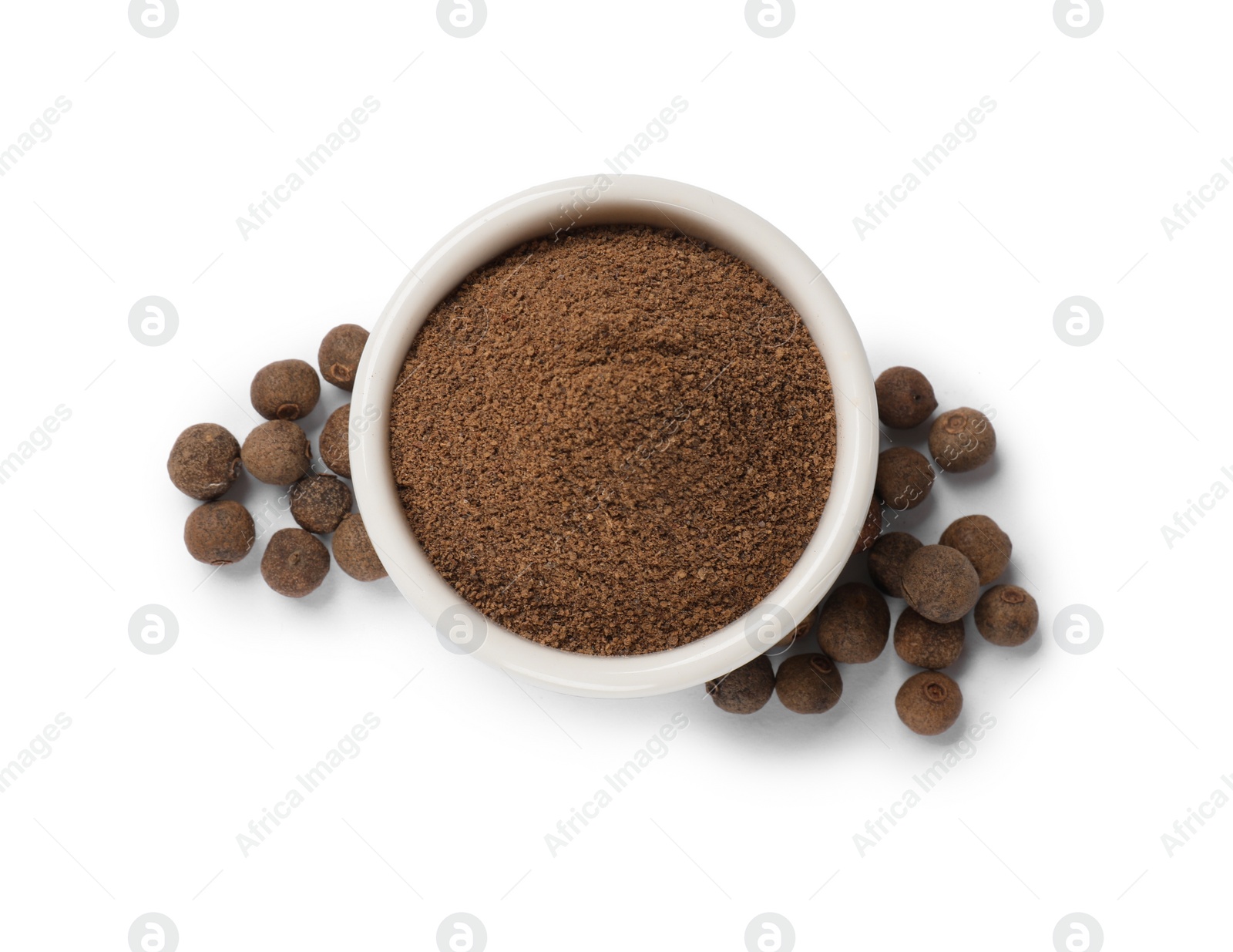 Photo of Ground and whole allspice berries (Jamaica pepper) isolated on white, top view