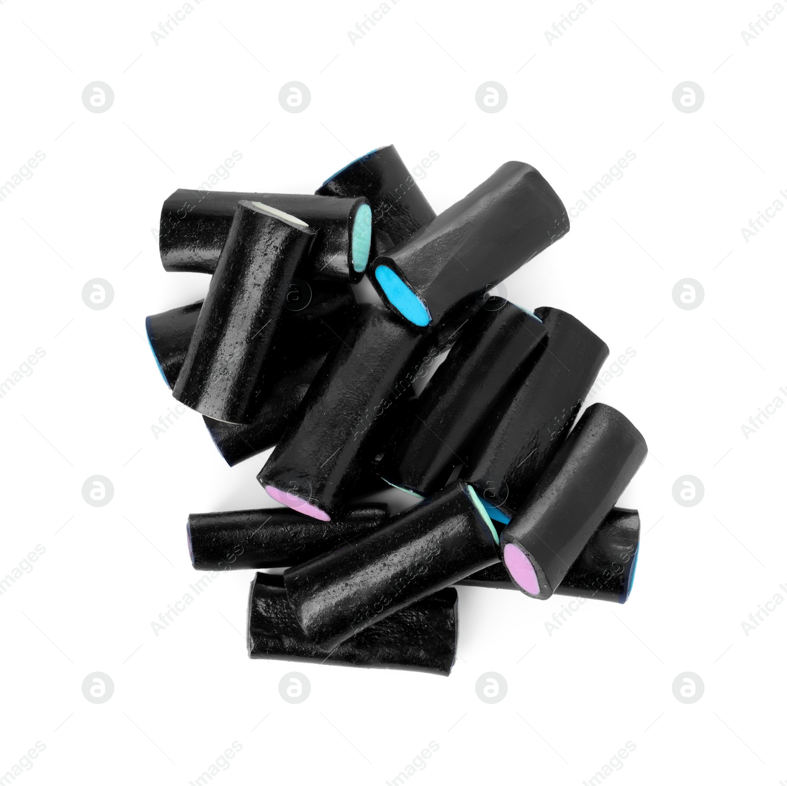 Photo of Delicious black liquorice candies isolated on white, top view