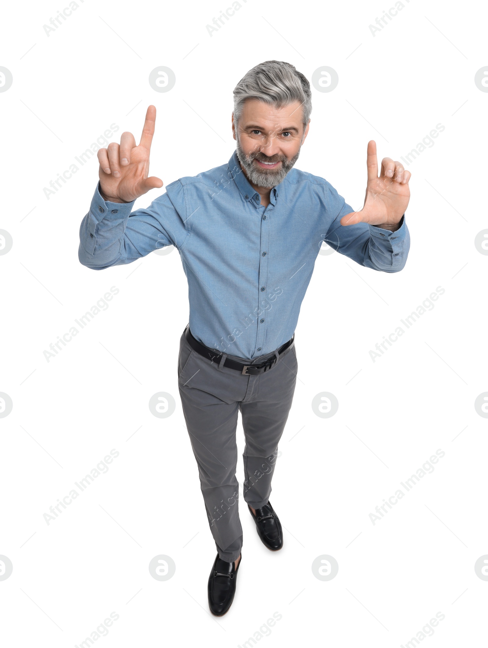 Photo of Mature businessman in stylish clothes posing on white background, above view