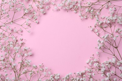 Photo of Frame of beautiful gypsophila flowers on pink background, flat lay. Space for text