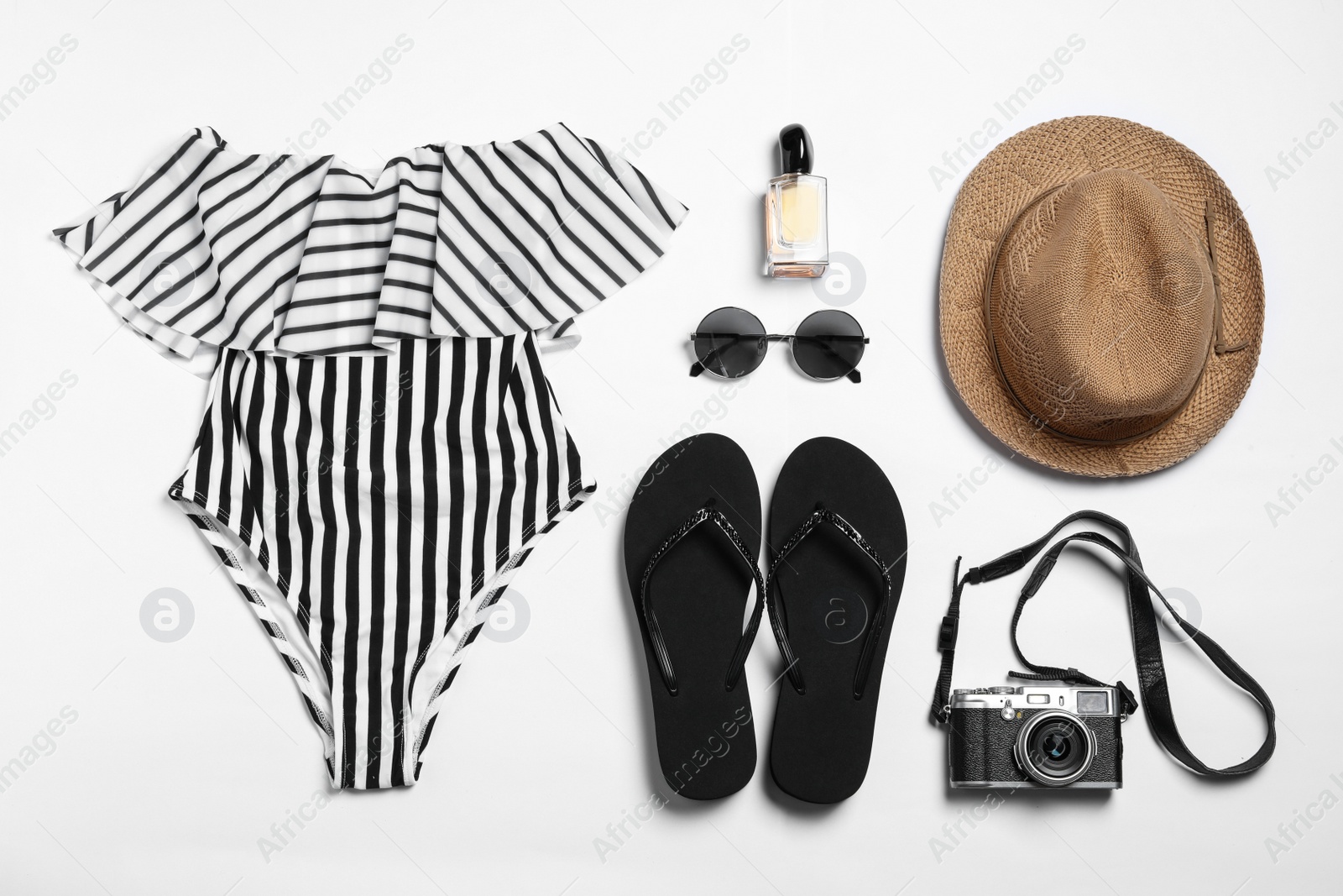 Photo of Flat lay composition with stylish beach accessories on white background