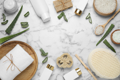 Photo of Flat lay composition with aloe vera and cosmetic products on white marble background. Space for text