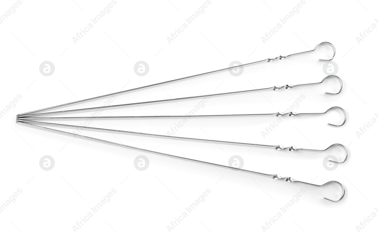 Photo of Metal skewers on white background, top view. Barbecue utensil