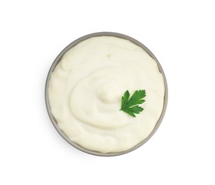 Photo of Tasty mayonnaise and parsley in bowl isolated on white, top view