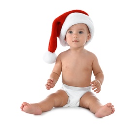 Cute little baby wearing Santa hat on white background. Christmas celebration
