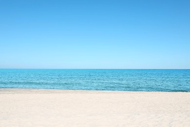 Photo of Picturesque view of sandy beach near sea