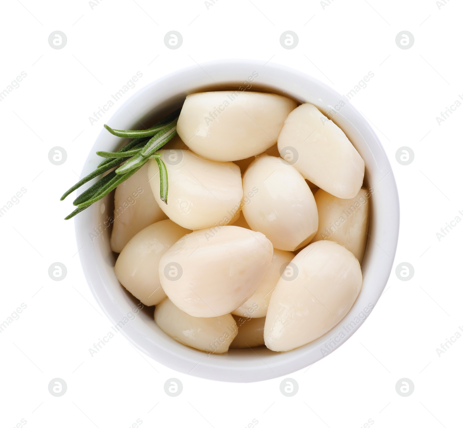 Photo of Bowl with preserved garlic and rosemary on white background, top view