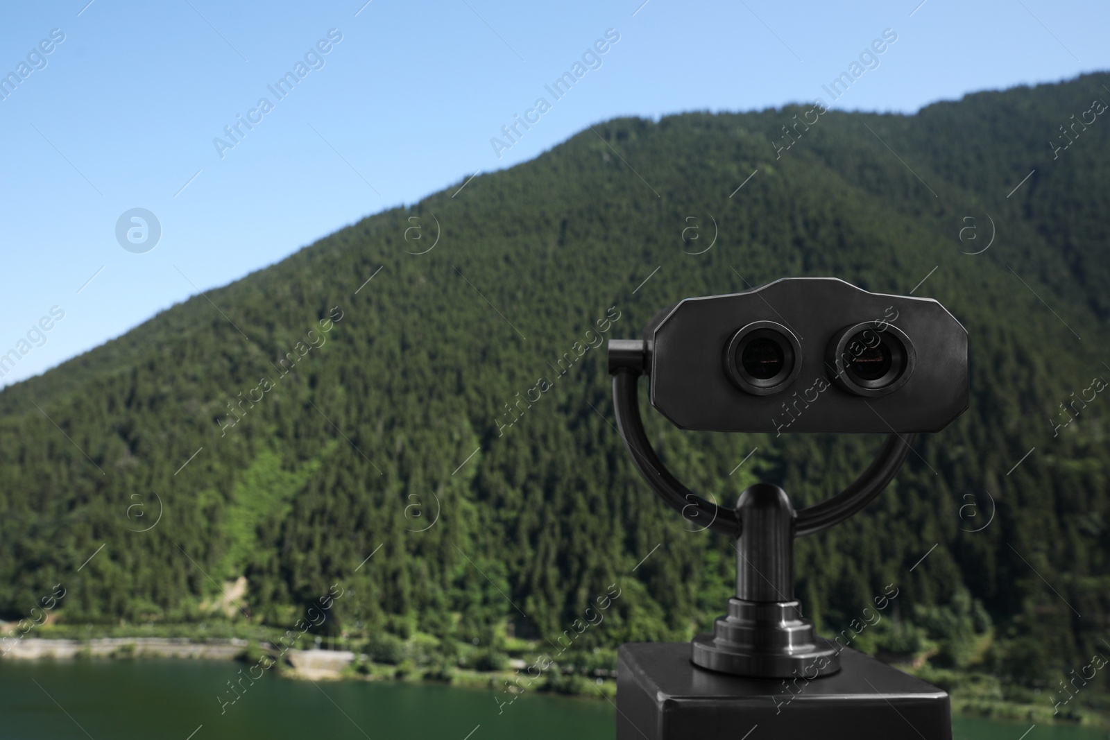 Photo of Observation viewer in mountains outdoors. Space for text