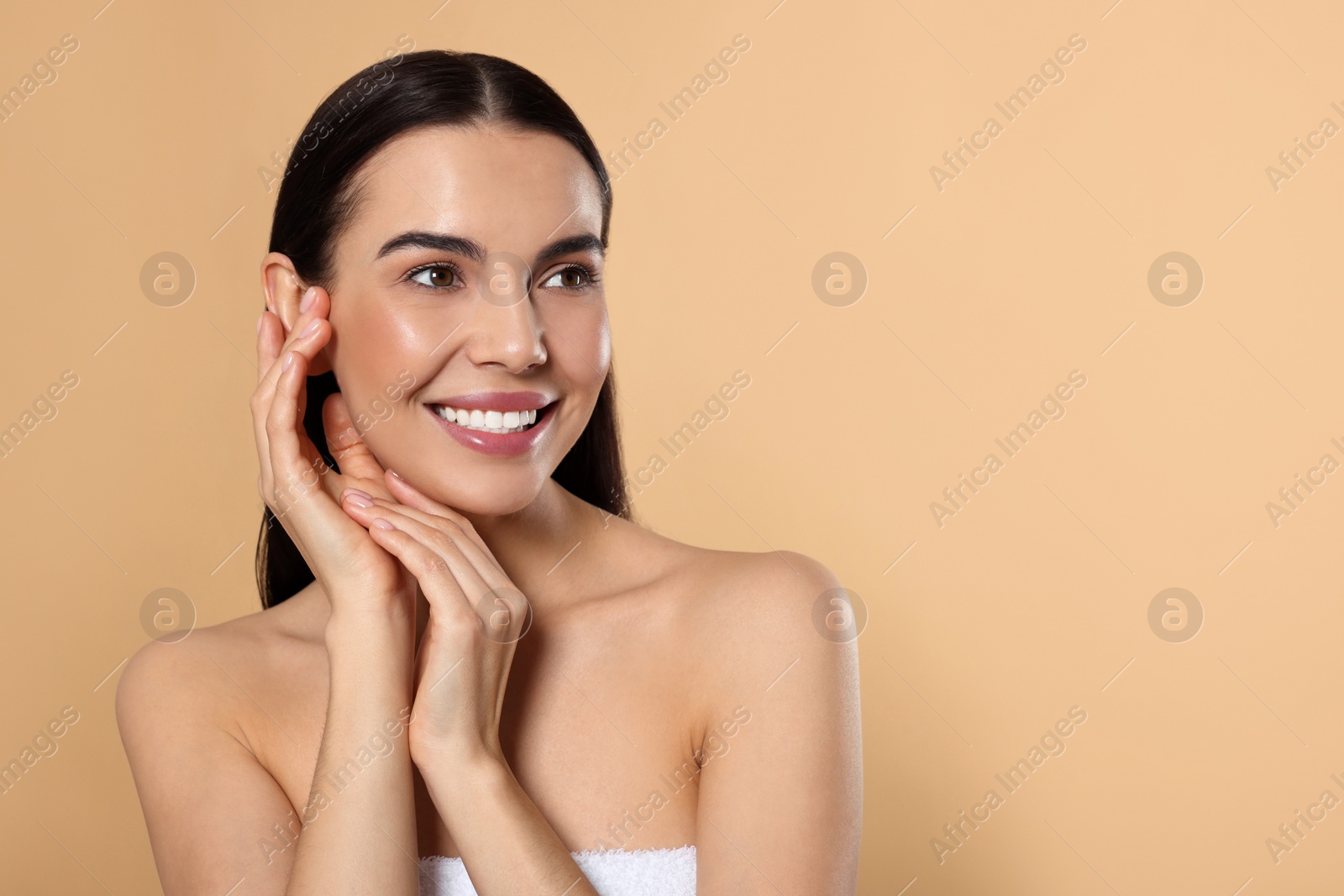 Photo of Portrait of attractive young woman on beige background, space for text. Spa treatment