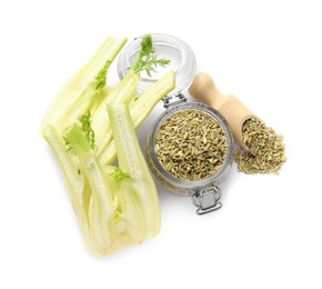 Photo of Cut fennel bulbs, scoop and jar with seeds isolated on white, top view