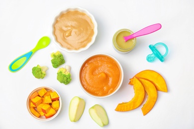 Photo of Flat lay composition with bowls of healthy baby food on white background