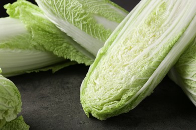 Fresh ripe Chinese cabbages on grey table, closeup