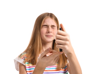 Photo of Teen girl using lancet pen on white background. Diabetes control
