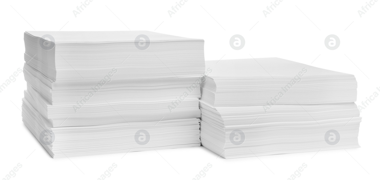 Photo of Stacks of paper sheets on white background