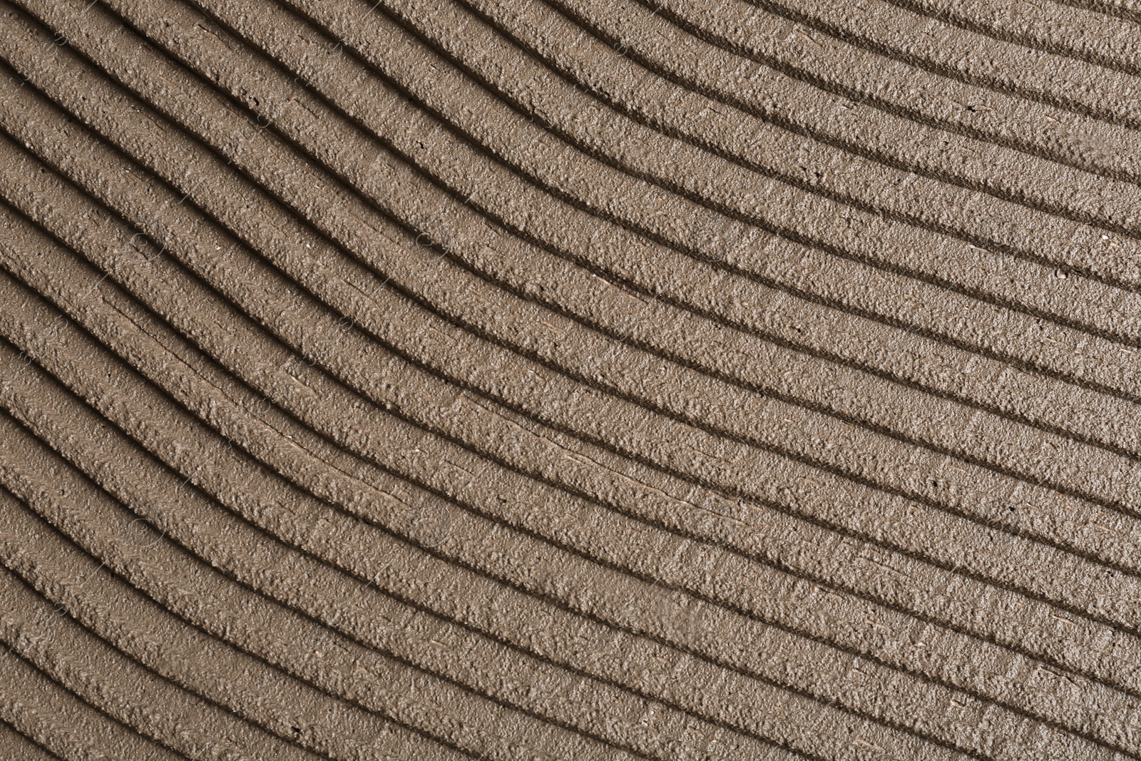 Photo of Lined grey concrete as background, top view. Tile installation