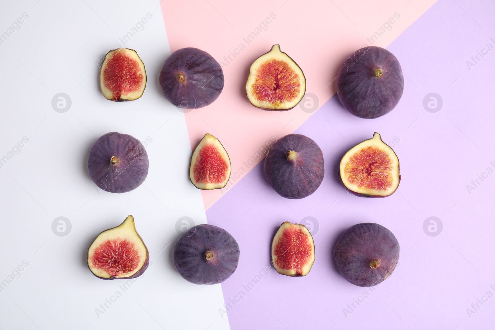 Photo of Delicious ripe figs on color background, flat lay